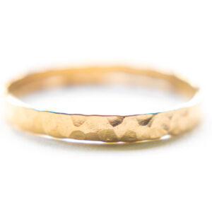 wide gold ring on white background