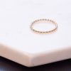 gold ball stacking ring on white background