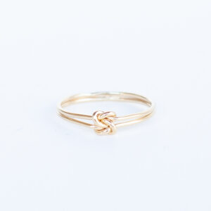 double knot ring on white background