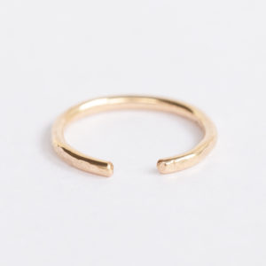 Opened hammered gold toe ring