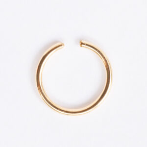 Aerial view of gold cuffed toe ring with smooth finish